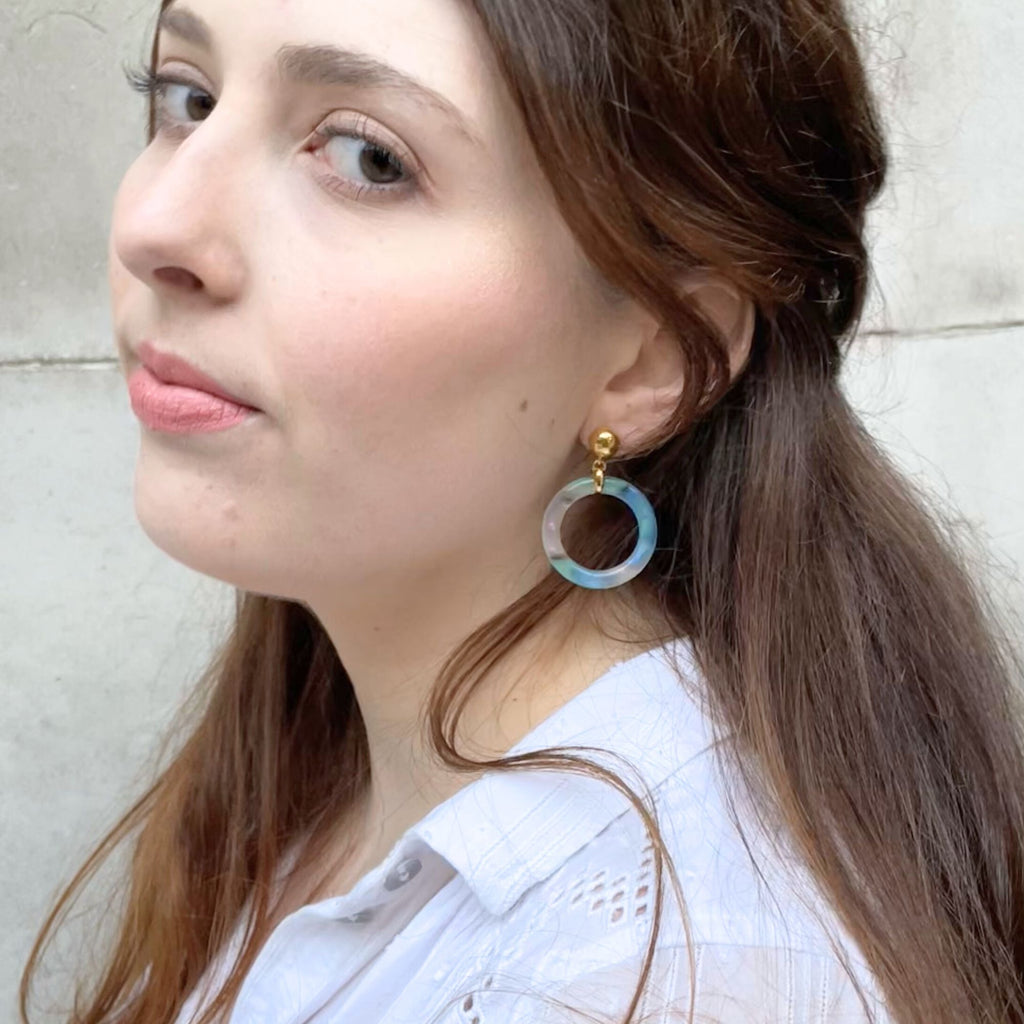 A light brown hair woman wearing blue earrings from the Audrey collection side view, earrings by Misia Mae